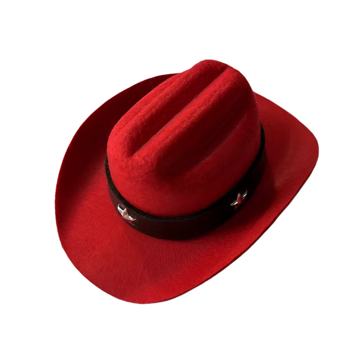 Red pet cowboy hat with a black band with stars on a white background.