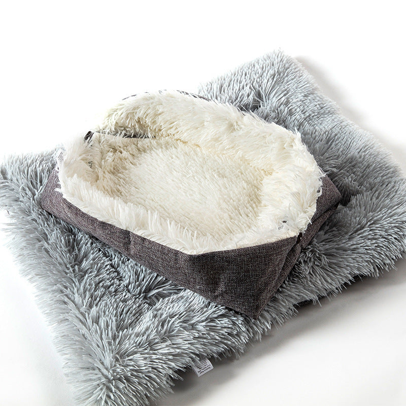 Gray fluffy foldable pet bed that can be converted to a mat on a white background