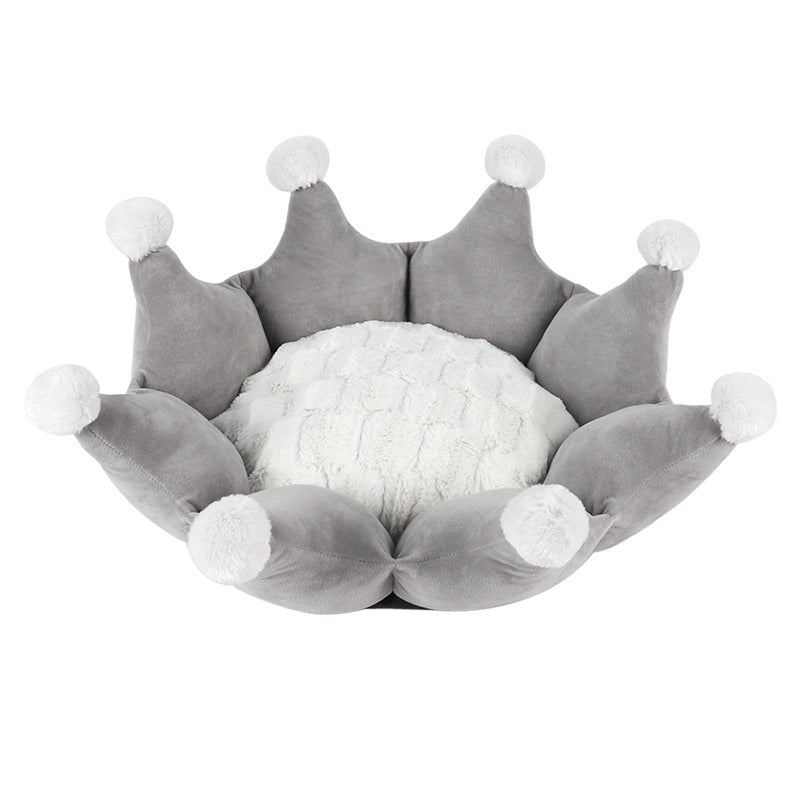 Gray crown-shaped pet bed with white pom-poms on a white background