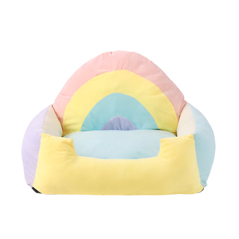 Colorful rainbow pet bed on a white background