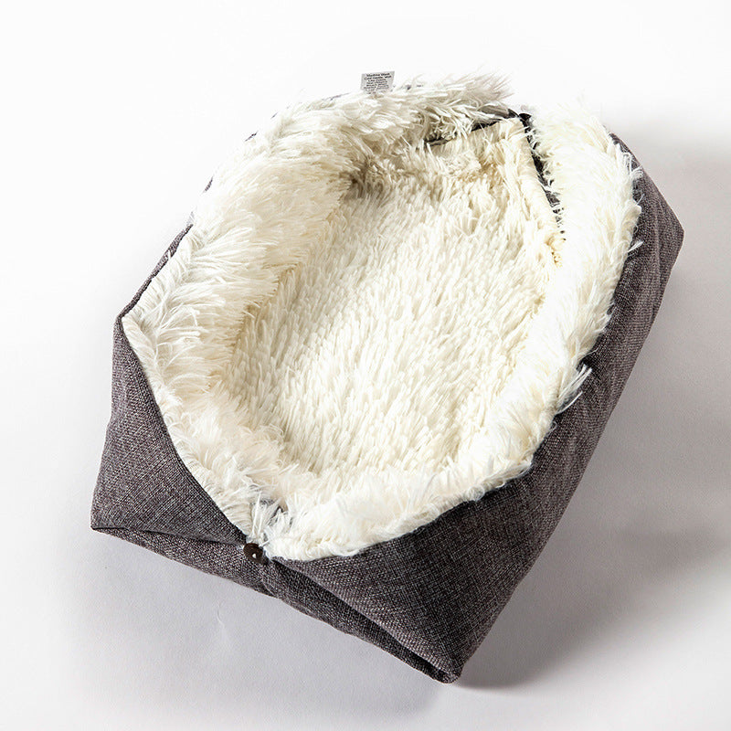 Foldable gray fluffy pet bed with a dark grey exterior and white interior on a white background