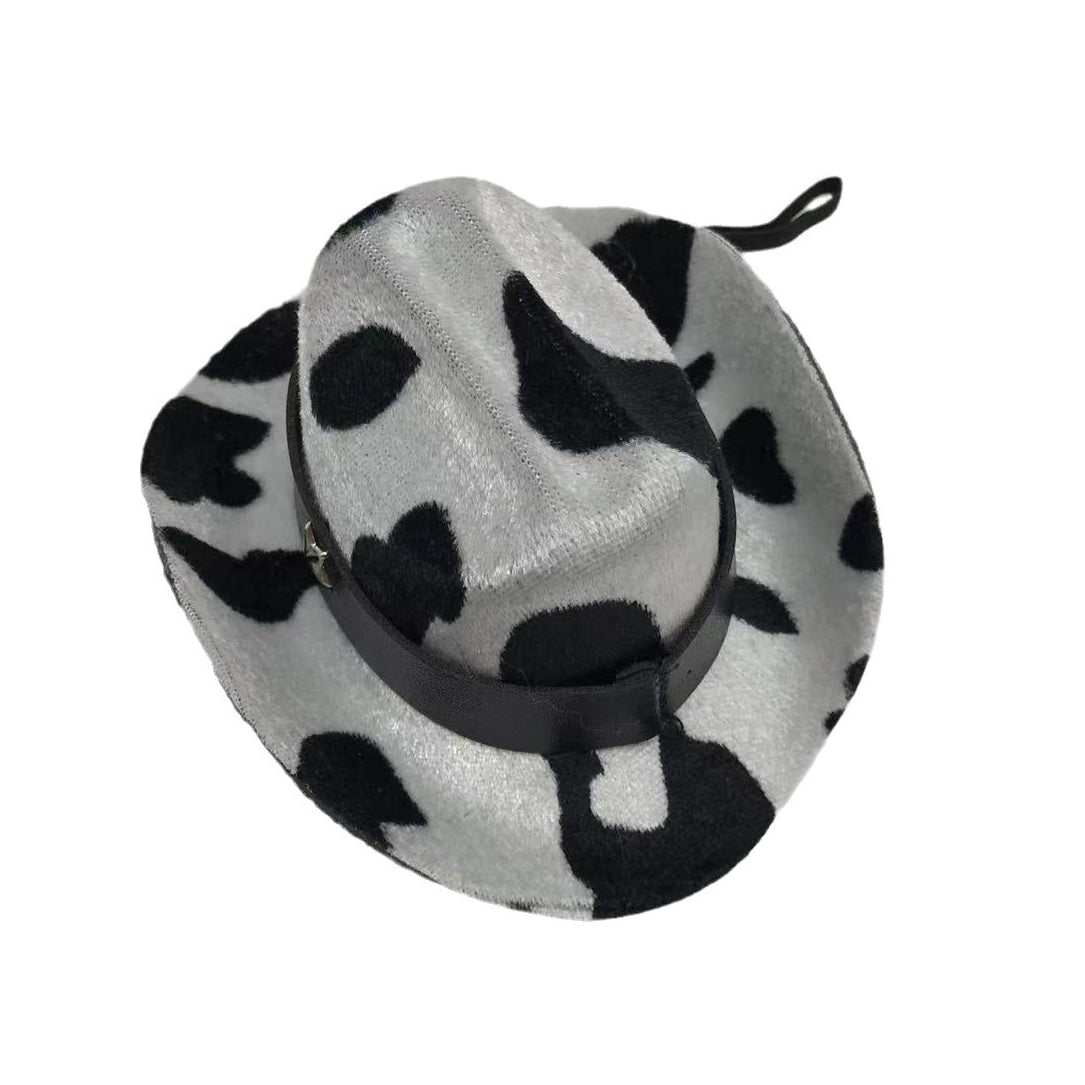 Pet cowboy hat with a black and white cow pattern on a white background