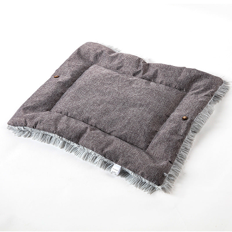 Bottom of gray fluffy pet bed on a white background