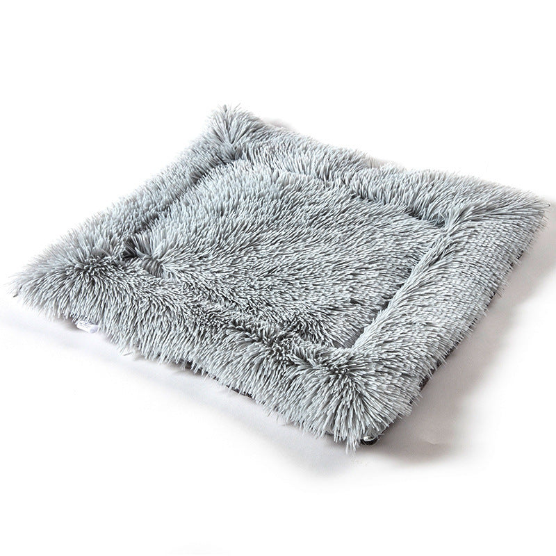 Gray fluffy pet mat on a white background